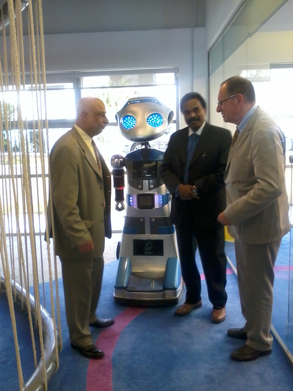 From Left to right, Engineer Khattab Omar Abuisbae, Mr. Joseph, and Mr. Philips, at "MENA ICT Forum 2014, With The  Amazing "Robotic Man", Amman City, Jordan.