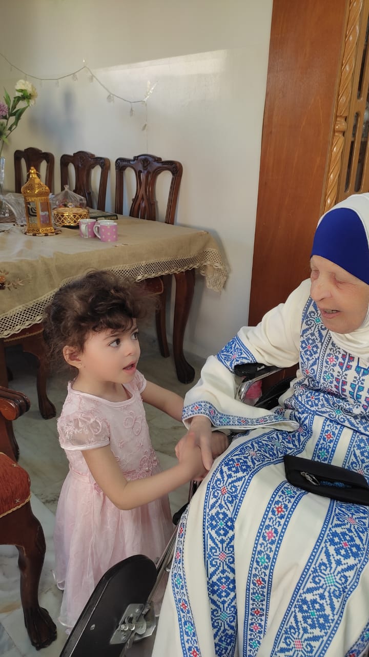 Engineer Khattab Omar Abuisbae's Mother "Khadeja Khaleel Aboosba", and her grand daughter "Waed", at His apartment, Amman City, Jordan, Year 2023, Photo1.