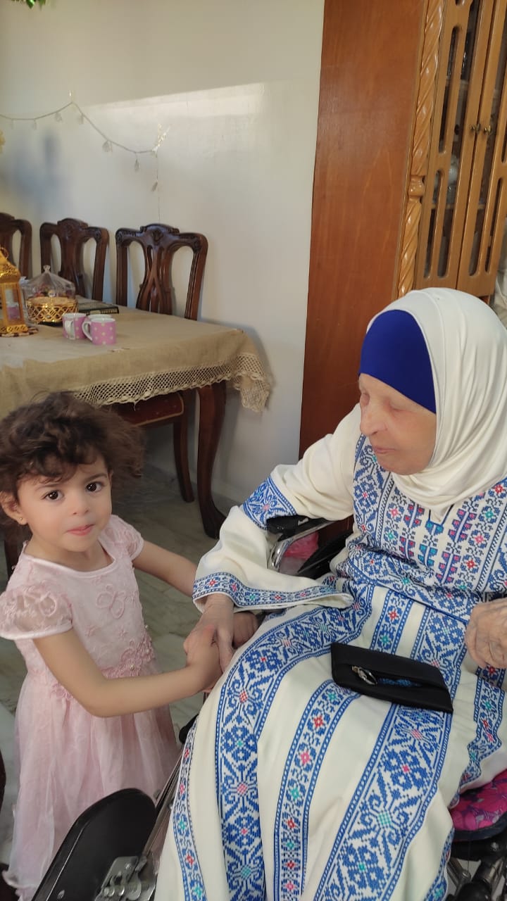 Engineer Khattab Omar Abuisbae's Mother "Khadeja Khaleel Aboosba", and her grand daughter "Waed", at His apartment, Amman City, Jordan, Year 2023, Photo3.